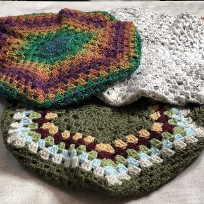 2 crochet berets made in colourful yarns